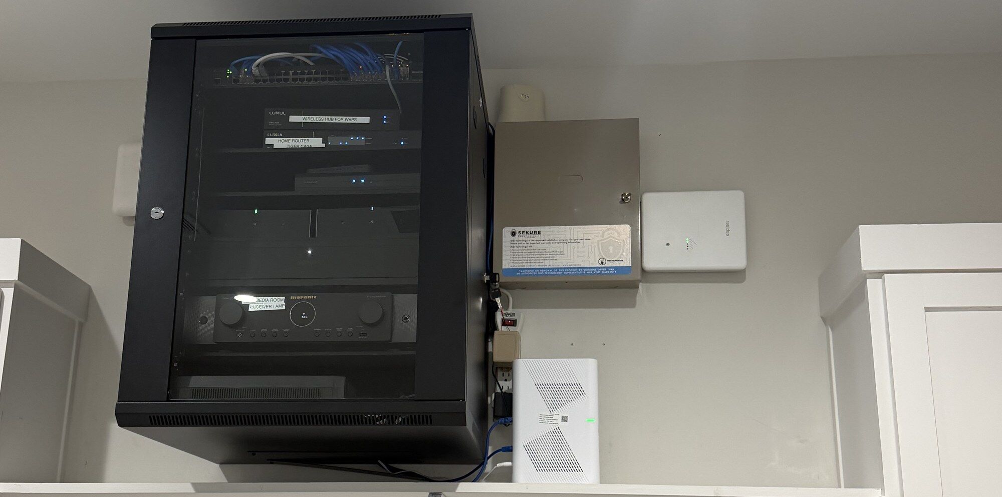After: a home's network, security panel and audio equipment